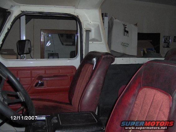 1979 Ford Bronco interior with red seats and door panel