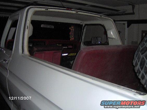 1979 Ford Bronco interior with red seats and visible date stamp