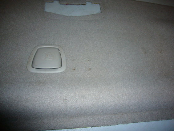 Interior carpet with a beige latch anchor visible