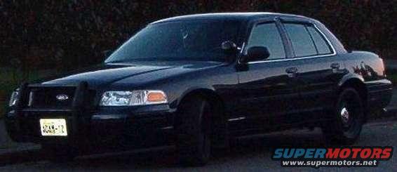Black 2001 Ford Crown Victoria with a push bar on the front grille