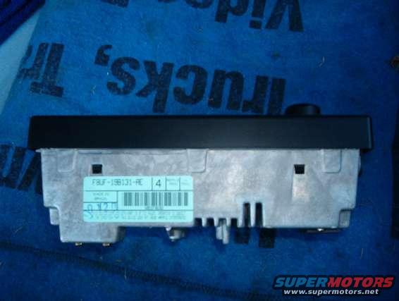 Car radio with a blue label showing a barcode and text