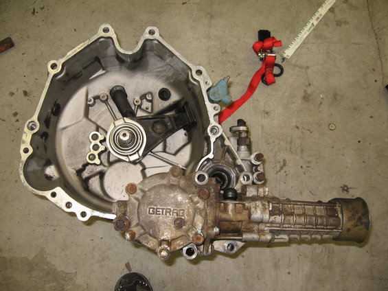 GETRAG transmission part with red strap and ruler