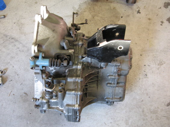 Car transmission assembly with black bracket attached