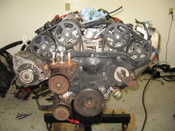 Engine with timing belts and pulleys