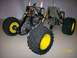 1979 Ford Bronco - Chassis of a remote control car, showing its mechanical components and large off-road tires.