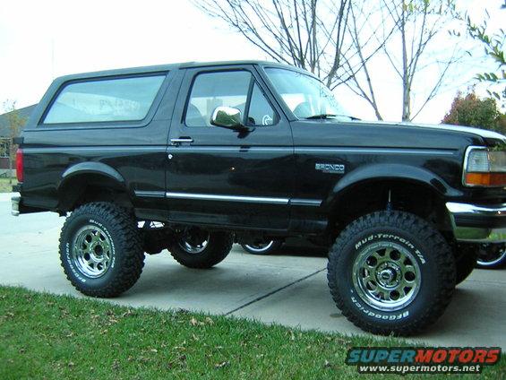 Black 1994 Ford Bronco with aftermarket wheels and tires, lifted suspension
