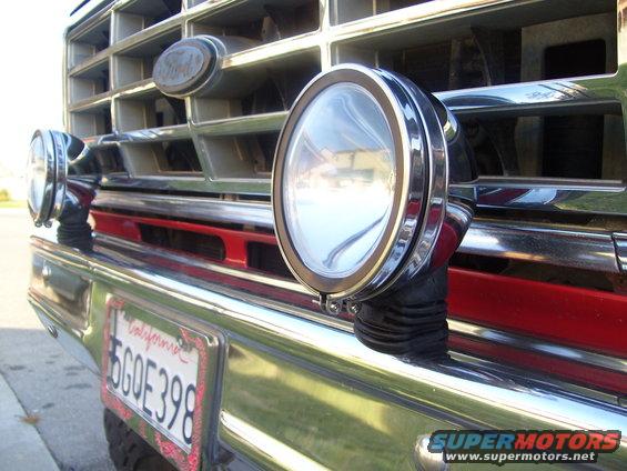 Ford Bronco grille with chrome accents, two round auxiliary lights, and a California license plate reading 6GOE398