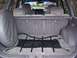 1994 Jeep Grand Cherokee - The cargo area of a 1994 Jeep Grand Cherokee features a spare tire and a cargo net.