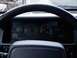 1994 Jeep Grand Cherokee - The interior of a 1994 Jeep Grand Cherokee displays its dashboard gauges and steering wheel.