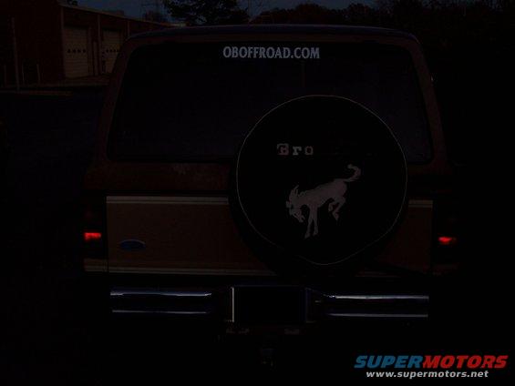 Rear view of a 1984 Ford Bronco II with a spare tire cover the Bronco logo