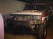 1986 Ford Bronco - This Ford Bronco appears to be undergoing modifications, with its front end partially disassembled.
