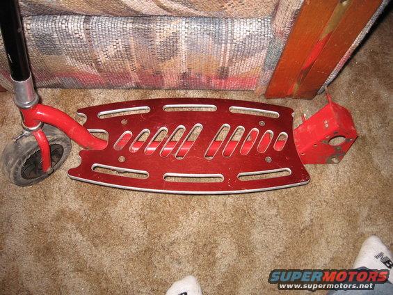 red kick scooter deck and front wheel