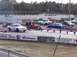 1999 Ford Crown Victoria - White 1999 Ford Crown Victoria at a drag strip event with multiple other vehicles present.