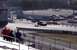 1999 Ford Crown Victoria - A drag strip event is underway with multiple vehicles visible on the track and in the background.