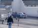 1999 Ford Crown Victoria - A blue pickup truck is seen at a drag strip event with people around.