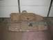 1991 Ford Bronco - Two tan rifle cases are shown, one is still in its original plastic packaging.