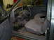 1994 Ford F-250 - The interior of a pickup truck shows grey seats and a dark dashboard with floor mats.
