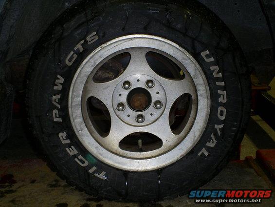 Close-up of a Uniroyal Tiger Paw GTS tire on a five-spoke wheel