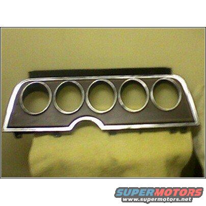 Dashboard gauge cluster bezel with five circular openings and chrome trim