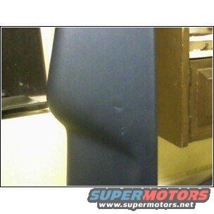 Close-up of a dark blue car fender with a subtle curve and a small dent. SuperMotors.net logo visible