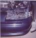 1994 Ford Taurus - In this pic, you can see that the header panel (black plastic attached to the bumper) is totally destroyed, and that th…