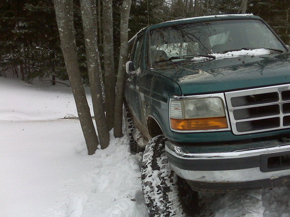 Green 1996 Ford Bronco in snow, 3q-front view
