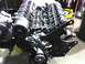 1991 Ford Mustang - Close-up view of an engine assembly with various components attached.