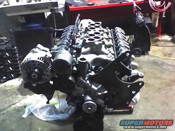 Engine assembly with alternator and intake manifold