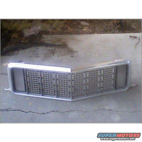 Front grille with a chrome surround and a rectangular grid pattern