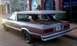 1972 Ford Ranchero - This modified vehicle appears to be a hearse conversion with a distinctive cross ornament on its roof.