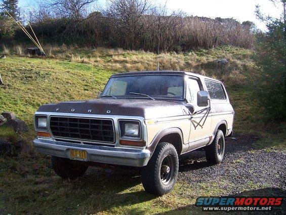 1978 Ford Bronco, tan and brown, 3/4 front view. License plate reads HLT-111