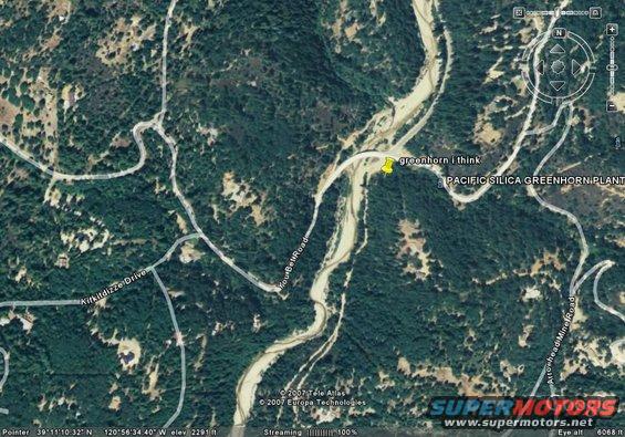 Aerial view of a rural area with roads, a river, and the Pacific Silica Greenhorn Plant