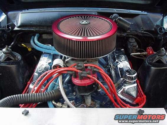 1966 Ford Fairlane engine bay, showing chrome valve covers, red spark plug wires, and a large circular air filter