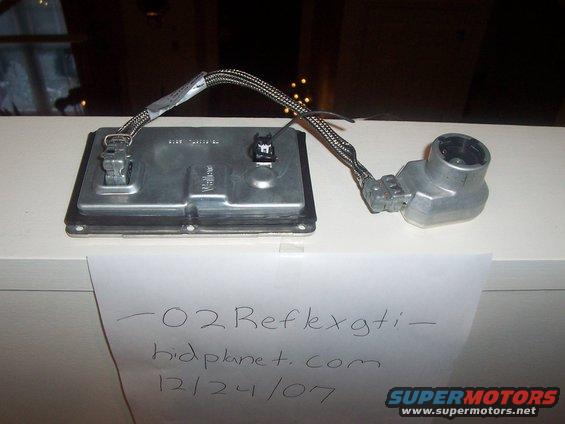 HID ballast and igniter assembly with handwritten label "-02 Reflexgti - hidplanet.com 12/24/07"