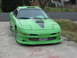 1994 Ford Probe - Front view of a modified 1994 Ford Probe with a custom body kit and hood scoop.