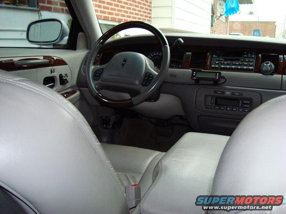 Interior of a 2002 Lincoln Town Car showing dashboard and seats