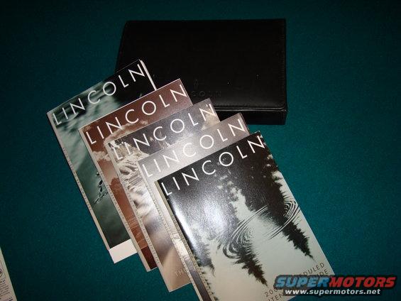 Stack of Lincoln brochures and owner's manual