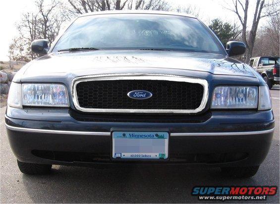 Black Ford Crown Victoria front view, honeycomb grille, Minnesota license plate