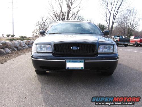 Front view of a 1998 Ford Crown Victoria grille with a Minnesota license plate