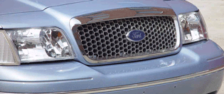 Close-up of a light blue Ford Crown Victoria grille with a Ford logo