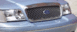 1999 Ford Crown Victoria - Front grille and headlights of a light blue Ford Crown Victoria.