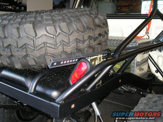 Spare tire and roll cage on a truck bed
