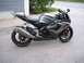 2006 Suzuki GSX-R 1000 - A Suzuki GSX-R 1000 motorcycle is parked outside a building.
