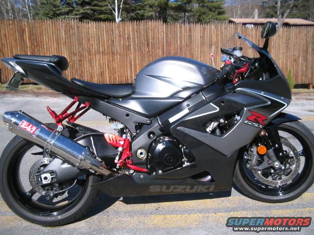 Gray Suzuki GSX-R 1000 motorcycle side view with Yoshimura exhaust