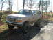 1996 Ford Bronco - This 1996 Ford Bronco is covered in mud after driving off-road.
