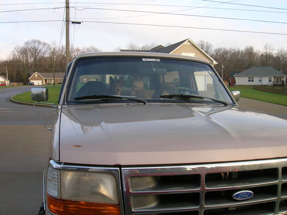 1996 Ford Bronco front view with two dogs in the cab