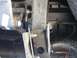 1981 Ford Bronco - Close-up view of the vehicle's undercarriage components, including suspension parts and a tire.