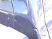 1981 Ford Bronco - Close-up of a damaged dark blue vehicle body panel with a visible watermark.