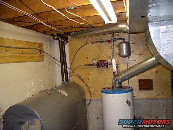 img_0337.jpg Separate oil water heater filled with glycol. Small cushion tank, very small 3 speed pump (less than 1 amp). Auto pressure release valve at the very top of the piping. 