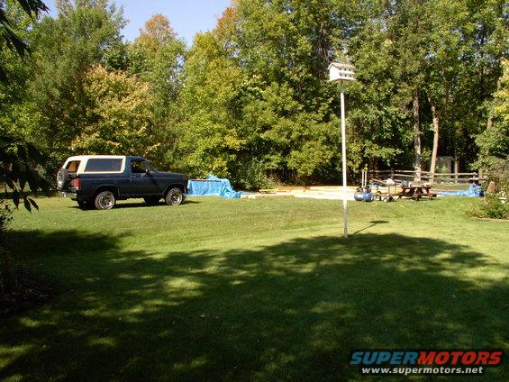 img_0219.jpg Bronco on the job, along with a pile of materials covered up in case of more rain.